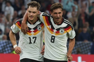 Germany's midfielder #17 Florian Wirtz (L)with his teammate Germany's midfielder #08 Tom Bischof. (Photo by Karl-Josef HILDENBRAND / AFP)
