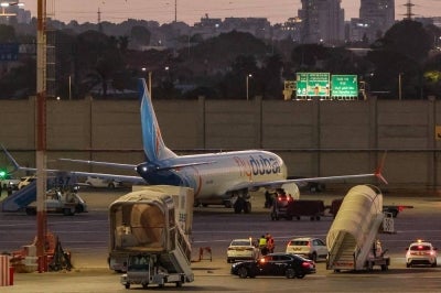 A flydubai Boeing 737 MAX 8 aircraft is pictured on the tarmac after landing at Israel's Ben Gurion Airport in Lod on Sept 30, 2026. - (Photo by JACK GUEZ / AFP)