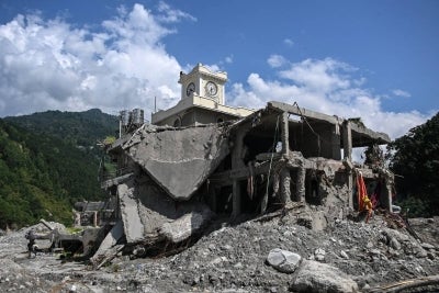 A general view shows damaged houses in the aftermath of the August 26 flash flood at Betrawati in Nepal's Nuwakot district on October 1, 2026. (Photo by PRAKASH MATHEMA / AFP)