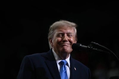 US President Donald Trump smiles during a campaign rally in Vandalia, Ohio, on October 3, 2026. (Photo by Brendan SMIALOWSKI / AFP)