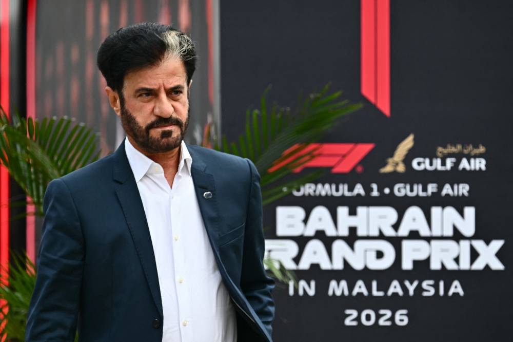 FIA President Mohammed Ben Sulayem arrives ahead of the Formula One Bahrain Grand Prix in Sepang on Oct 4, 2026. - (Photo by LILLIAN SUWANRUMPHA / AFP)