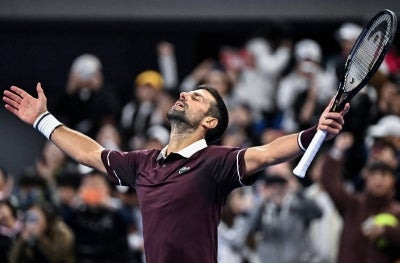 Serbia's Novak Djokovic celebrates his victory over Germany’s Alexander Zverev.(Photo by Pedro PARDO / AFP)