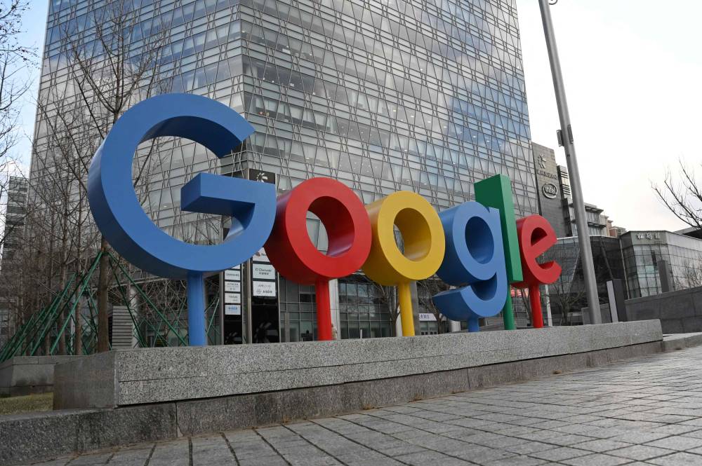 The Google logo is seen outside a building housing Google offices in Beijing. AFP photo.
