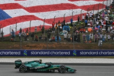 Aston Martin's Spanish driver Fernando Alonso steers his car during the Formula One Bahrain Grand Prix in Sepang on October 4, 2026. (Photo by Lillian SUWANRUMPHA / AFP)