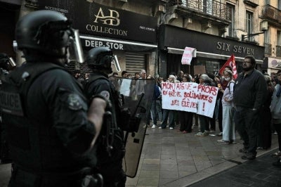 Riot police officers face teachers holding a banner reading "Montaigne – Teachers on strike, in solidarity with the students!" during a demonstration as part of a nationwide protest movement of high-school students over learning conditions in the south-western city of Bordeaux on October 6, 2026. Since late September, pupils have barred the entrances to hundreds of schools, complaining of teacher absences, overloaded timetables, dilapidated classrooms and buildings ill-adapted to rising temperatures, among other grievances. -AFP Photo