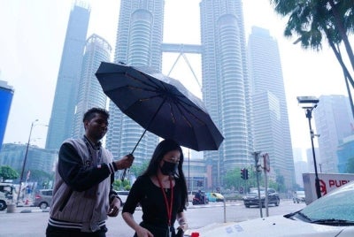 Malaysia is expected to enter the monsoon transition phase on Oct 9, reducing transboundary haze but increasing thunderstorms, heavy rain and flash flood risks. - Photo by MOHD HALIM ABDUL WAHID