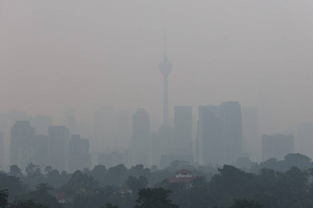 A view of the Kuala Lumpur skyline barely visible through the haze currently affecting the region. -Bernama FILE PIX