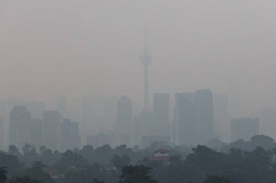 A view of the Kuala Lumpur skyline barely visible through the haze currently affecting the region. -Bernama FILE PIX