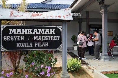 A pair of Form Four boys of a sports school here were charged at the Magistrate's Court here with the murder of their Form Two schoolmate. Photo by Bernama