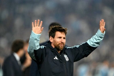 Argentina's forward #10 Lionel Messi waves to fans in a tribute after the international friendly football match between Argentina and Benin at the Mas Monumental stadium in Buenos Aires on October 6, 2026. (Photo by Luis ROBAYO / AFP)