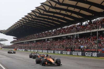 McLaren's Australian driver Oscar Piastri (front), Audi's German driver Nico Hulkenberg (middle) and Audi's Brazilian driver Gabriel Bortoleto (back) steer their cars during the Formula One Bahrain Grand Prix in Sepang on October 4, 2026. (Photo by Annice Lyn / POOL / AFP)