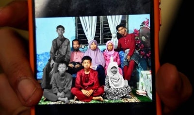 In the incident, at about 7.20am, Nor Daniel Aiman was taking his two younger siblings to Sekolah Kebangsaan (SK) Parit Sapran on a motorcycle when they were involved in an accident with a lorry at Jalan Kampung Parit Haji Siraj. Photo by Bernama