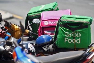 The government and Grab will jointly fund a RM160 million package from 2027 to improve the net income and welfare of e-hailing drivers and p-hailing delivery riders.