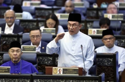 Finance Minister and Prime Minister Datuk Seri Anwar Ibrahim tables the 2027 Budget at the Dewan Rakyat, today. - Photo by Bernama