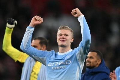 Manchester City's Norwegian striker Erling Haaland celebrates on the pitch after the English Premier League football match between Liverpool and Manchester City at Anfield in Liverpool, north west England on October 11, 2026. Manchester City won the game 3-0. (Photo by Paul ELLIS / AFP)