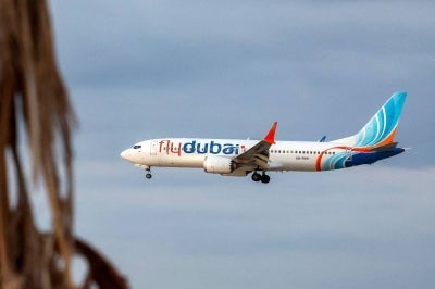 A flydubai Boeing 737 MAX 8 aircraft prepares for landing at Israel's Ben Gurion Airport in Lod on September 30, 2026. A passenger on a rerouted flydubai flight that was bound for Tel Aviv said one of the pilots tried to crash the plane and kill everyone on board, after both pilots were found to be wounded on landing in Saudi Arabia. In the first comment by an official, Israel's far-right national security minister Itamar Ben Gvir alleged an attempted "terrorist" attack in the incident, in which none of the passengers reported injuries. (Photo by Jack GUEZ / AFP)
