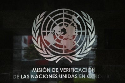 The UN logo is pictured at the headquarters of the UN Verification Mission in Colombia, in Bogota. (Photo by Pablo VERA / AFP)
