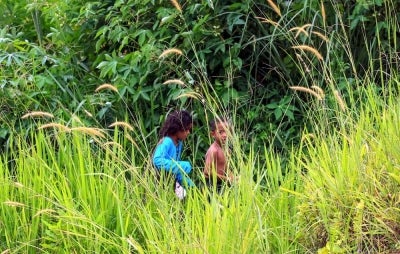 Orang Asli children play around their village in Pos Balar, Gua Musang. The National Registration Department (JPN) is providing services to the Orang Asli community in the remote area, particularly for registration and personal documentation. Photo by Bernama