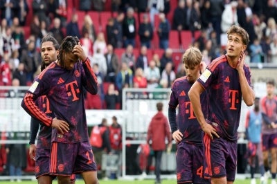 Bayern players in distraught after their draw against underdog Viking. Photo by AFP