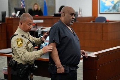 Duane Davis (R). (Photo by John Locher / POOL / AFP)