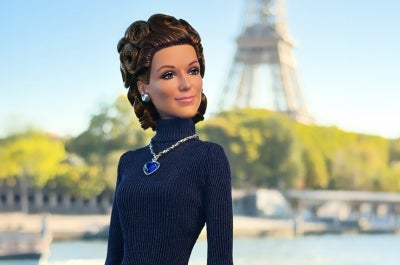 The appearance of the doll pays tribute to the navy, long-sleeved dress Dion wore when she performed Titanic theme song My Heart Will Go On at the Academy Awards in 1998. Photo via Mattel