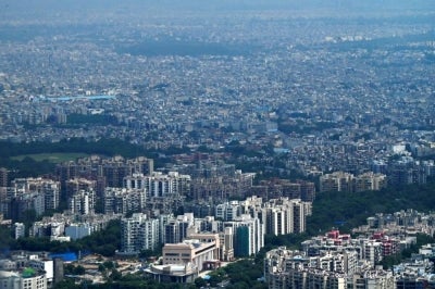 An aerial view of the New Delhi city and its suburbs is pictured from an airplane. (Photo by Tauseef MUSTAFA / AFP)
