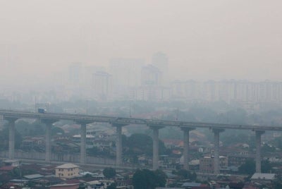 Students who attend school are also encouraged to wear face masks as a precaution, the department said. Photo: Bernama