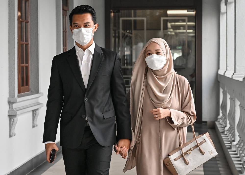 Fashion Valet founders Datin Vivy Sofinas Yusof and her husband, Datuk Fadzarudin Shah Anuar at the Kuala Lumpur Sessions Court, today, for their trial on charges of criminal breach of trust involving RM8 million in investment funds from Khazanah and PNB. - Photo by Bernama