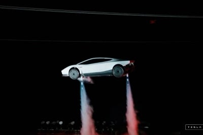 A grab taken on October 16, 2026 from a live feed released by Tesla shows the company unveiling on October 15 its next-generation Roadster electric car in McGregor, Texas, United States. (Photo by Tesla / AFP)
