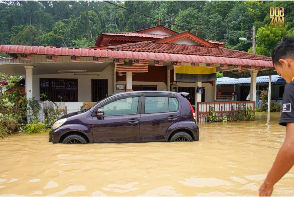 The viral Myvi that carried former Arsenal star Mesut Ozil was submerged in flash floods that hit Pulau Pangkor on Sunday.