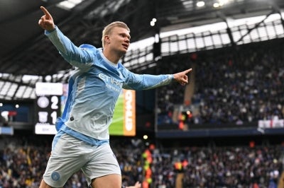 Manchester City's Norwegian striker #09 Erling Haaland celebrates scoring the team's third goal. Photo by AFP
