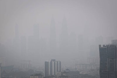 Haze blanketing the capital has reduced visibility, leaving the Petronas Twin Towers (KLCC) looking hazy during a check on Oct 18. Bernama FILE PIX