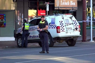 This frame grab taken from video footage provided by the Australian Broadcasting Corporation (ABC) on October 19, 2026 via AFPTV shows police officers at the scene after Australian independent lawmaker Helen Haines was struck by a car and suffered critical injuries outside her office in Wangaratta, about 200 kilometres northeast of Melbourne. Haines was being treated in hospital for critical injuries October 19 after being struck deliberately by a car in what officials described as a "violent" attack. -AFP Photo