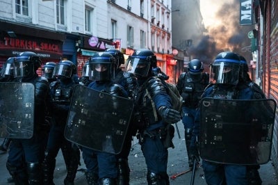 Paris police issued an overnight curfew on Monday in two areas of the French capital, after a weekend marred by France’s worst rioting in years that targeted city halls, other public buildings and thousands of businesses across the country. (Photo by Matthieu RONDEL / AFP)
