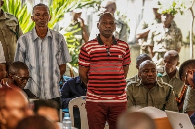Self-proclaimed pastor Paul Mackenzie and his co-accused stand during their court appearance at the Mombasa Law Courts in Mombasa on October 19, 2026. Photo by AFP