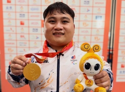 National para-powerlifting champion Bonnie Bunyau Gustin celebrates after winning gold in the men’s 72kg event at the Aichi-Nagoya 2026 Asian Para Games, securing Malaysia’s second gold medal on Tuesday. -Photo Source: Instagram
