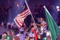 The Malaysian contingent waved the Jalur Gemilang enthusiastically as they entered the parade hall at the official opening ceremony of the Aichi-Nagoya 2026 Asian Games at Nagoya City Mizuho Park Athletic Stadium today. Photo by Bernama