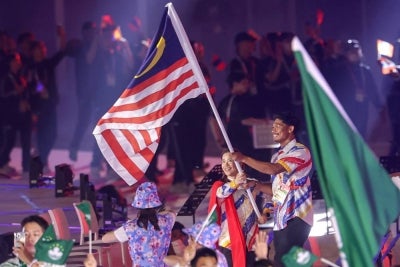 The Malaysian contingent waved the Jalur Gemilang enthusiastically as they entered the parade hall at the official opening ceremony of the Aichi-Nagoya 2026 Asian Games at Nagoya City Mizuho Park Athletic Stadium today. Photo by Bernama
