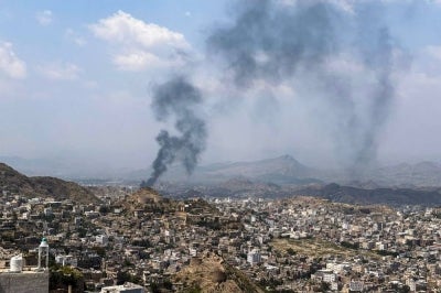 Smoke billows from a site that was targeted during battles between Saudi-backed Yemeni government fighters and Yemen's Iran-backed Houthis at the Jabal Han front, west of the city of Taiz, on Oct 21, 2026. - (Photo by AFP)