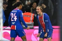 PSG's Belgian forward #22 Mika Godts (R) celebrates with PSG's French midfielder #24 Senny Mayulu (L) after scoring PSG's second goal during the French L1 football match between Paris Saint-Germain (PSG) and Olympique Lyonnais (OL) at the Parc des Princes stadium in Paris on October 26, 2026. (Photo by JULIEN DE ROSA / AFP)