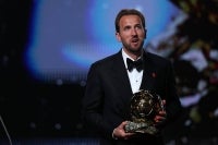 England and Bayern Munich forward Harry Kane reacts after receiving the Ballon d'Or award for the best male footballer during the 2026 Ballon d'Or France Football award ceremony at the Palladium Theatre in London on October 26, 2026. (Photo by FRANCK FIFE / AFP)