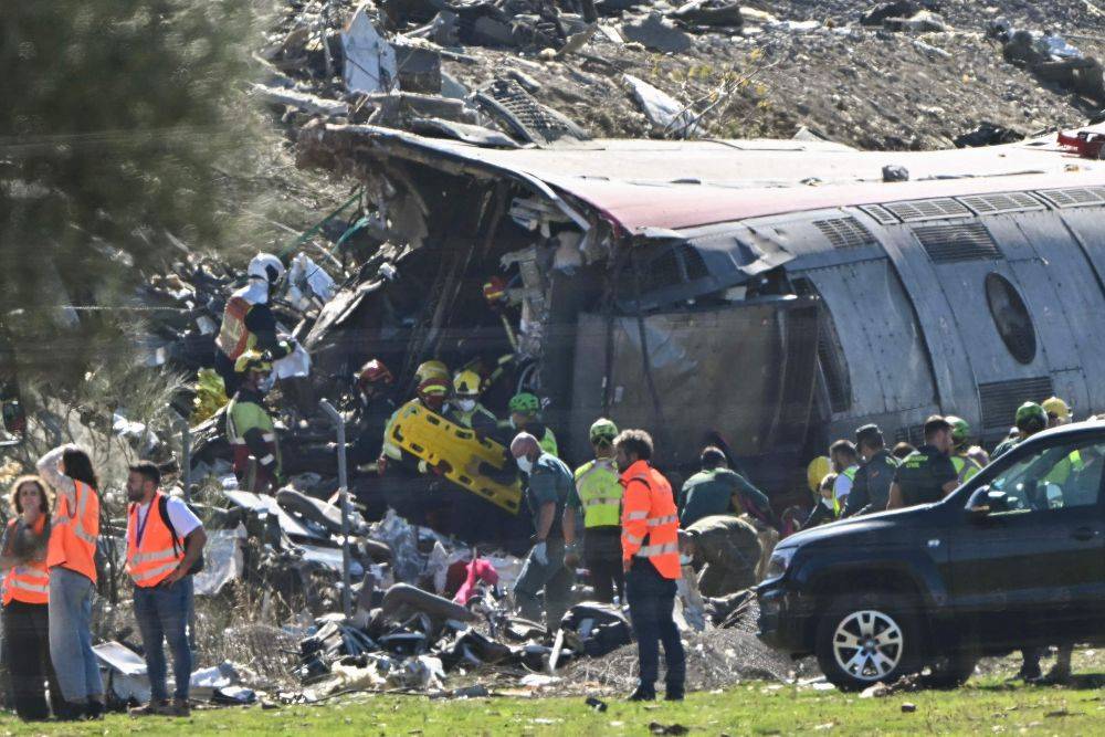 Emergency services work at the site of a train collision between a high speed Renfe AVE train and Iryo train around 150kms south of Madrid between Urda and Los Yebenes in the province of Toledo. Photo by AFP