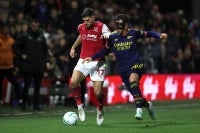 Arsenal's Spanish defender #36 Martin Zubimendi (R) vies with Fleetwood Town's Welsh striker #17 Ched Evans during the English League Cup fourth round football match between Fleetwood Town and Arsenal at Highbury Stadium in Fleetwood, north west England, on October 27, 2026. (Photo by Darren Staples / AFP) / RESTRICTED TO EDITORIAL USE. No use with unauthorized audio, video, data, fixture lists, club/league logos or 'live' services. Online in-match use limited to 120 images. An additional 40 images may be used in extra time. No video emulation. Social media in-match use limited to 120 images. An additional 40 images may be used in extra time. No use in betting publications, games or single club/league/player publications. /