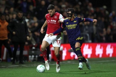 Arsenal's Spanish defender #36 Martin Zubimendi (R) vies with Fleetwood Town's Welsh striker #17 Ched Evans during the English League Cup fourth round football match between Fleetwood Town and Arsenal at Highbury Stadium in Fleetwood, north west England, on October 27, 2026. (Photo by Darren Staples / AFP) / RESTRICTED TO EDITORIAL USE. No use with unauthorized audio, video, data, fixture lists, club/league logos or 'live' services. Online in-match use limited to 120 images. An additional 40 images may be used in extra time. No video emulation. Social media in-match use limited to 120 images. An additional 40 images may be used in extra time. No use in betting publications, games or single club/league/player publications. /