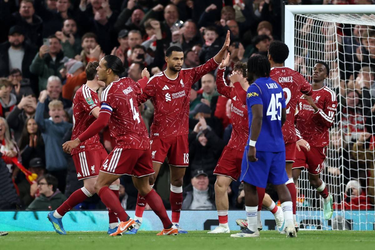 Liverpool's Dutch striker #18 Cody Gakpo (C) celebrates scoring the team's first goal during the English League Cup fourth round football match between Liverpool and Chelsea at Anfield in Liverpool, north west England on October 28, 2026. (Photo by Darren Staples / AFP)