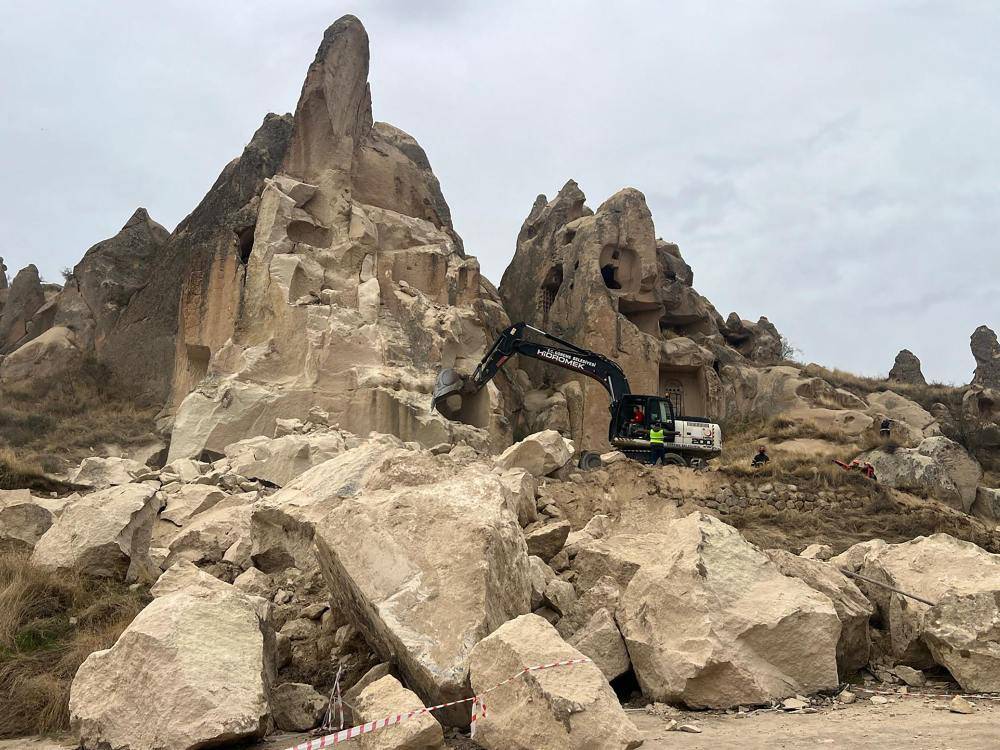 A landslide triggered by heavy rainfall caused a rock spire to collapse in Turkey's Cappadocia tourist region, killing two people, the local governor said. Photo by Handout/DHA/AFP