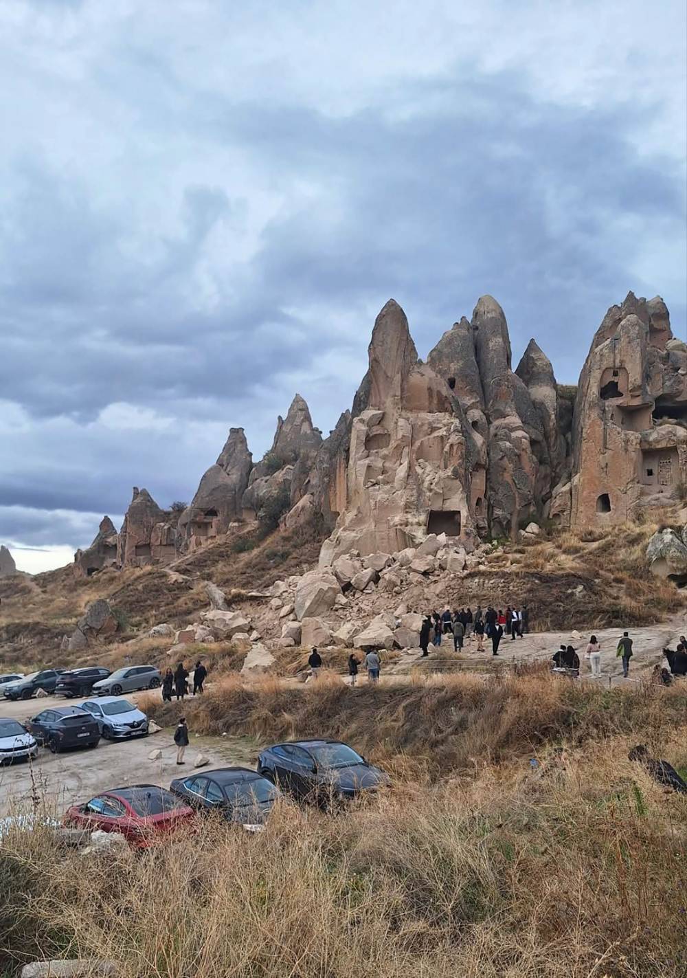 A landslide triggered by heavy rainfall caused a rock spire to collapse in Turkey's Cappadocia tourist region, killing two people, the local governor said. Photo by Handout/DHA/AFP