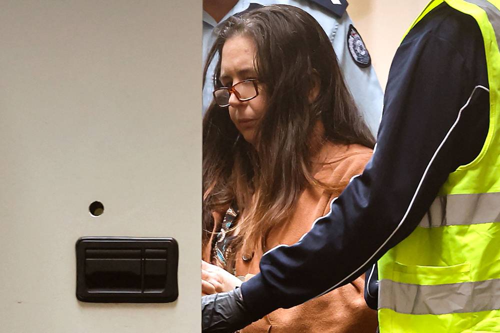 (FILES) Convicted killer Erin Patterson leaves the Supreme Court of Victoria in Melbourne on Sept 8, 2025. - (Photo by MARTIN KEEP / AFP)