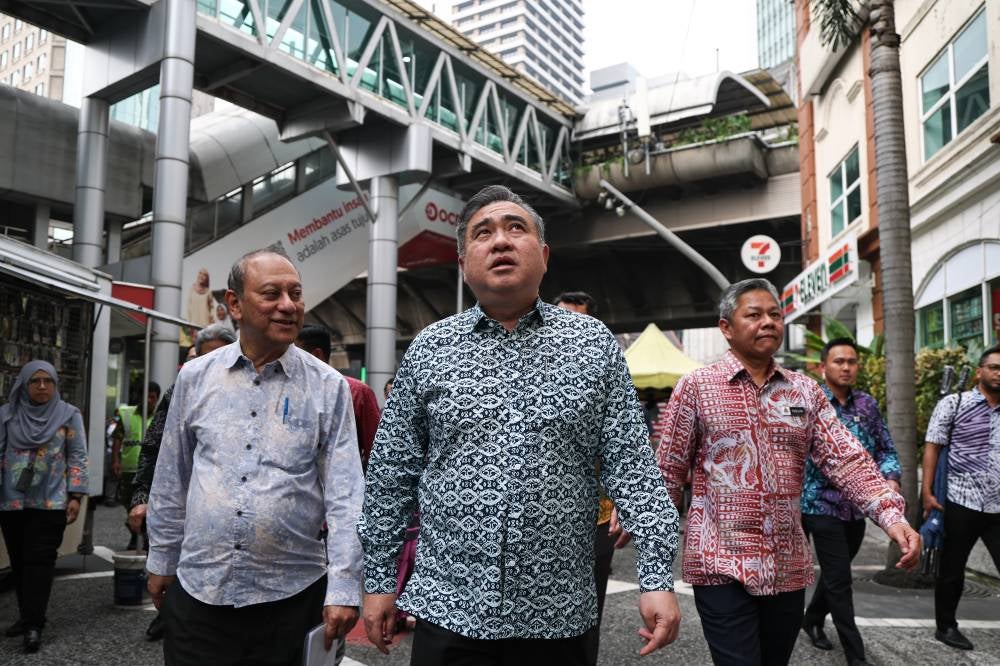Transport Minister Anthony Loke toured the vicinity of the Masjid Jamek LRT Station during the launch ceremony for the Masjid Jamek LRT Station beautification project on Oct 22, 2026. Also present were Kuala Lumpur Mayor Datuk Fadlun Mak Ujud (third from right) and Prasarana Group chief executive officer Dr Prodyut Dutt (second from left). - Photo by Bernama