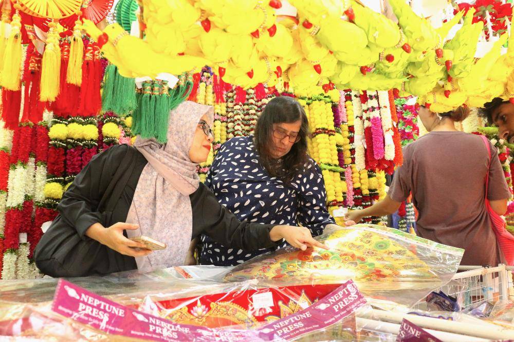 The popular shopping enclave found an array of goods for the Festival of Light, from traditional clothing and footwear to accessories and sweets, drawing crowds keen to complete their preparations early. Photo by Bernama